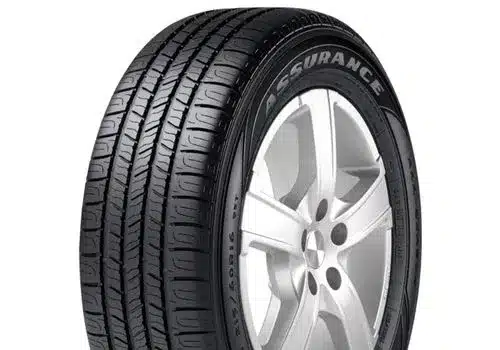 Close-up view of a Goodyear Assurance tire showcasing its tread design and sidewall details, suitable for enhanced grip and performance on various road conditions.
