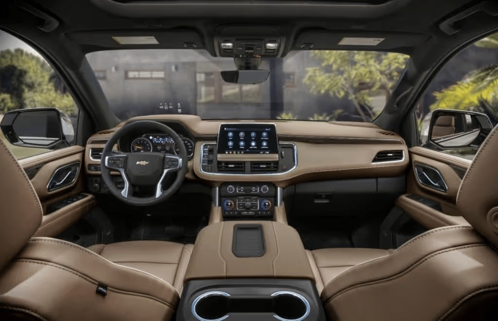 Interior view of a Chevrolet vehicle showcasing a modern dashboard, leather-trimmed seats, digital display, and user-friendly controls, emphasizing luxury and comfort for the driver and passengers.