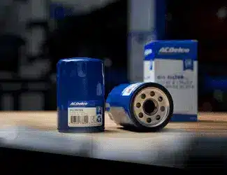 Close-up of a car tire showcasing the tread pattern and a blue stripe, emphasizing its design for traction and performance.