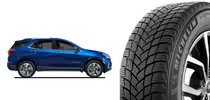 Gray alloy car wheel with five spokes next to a black tire with traction grooves.