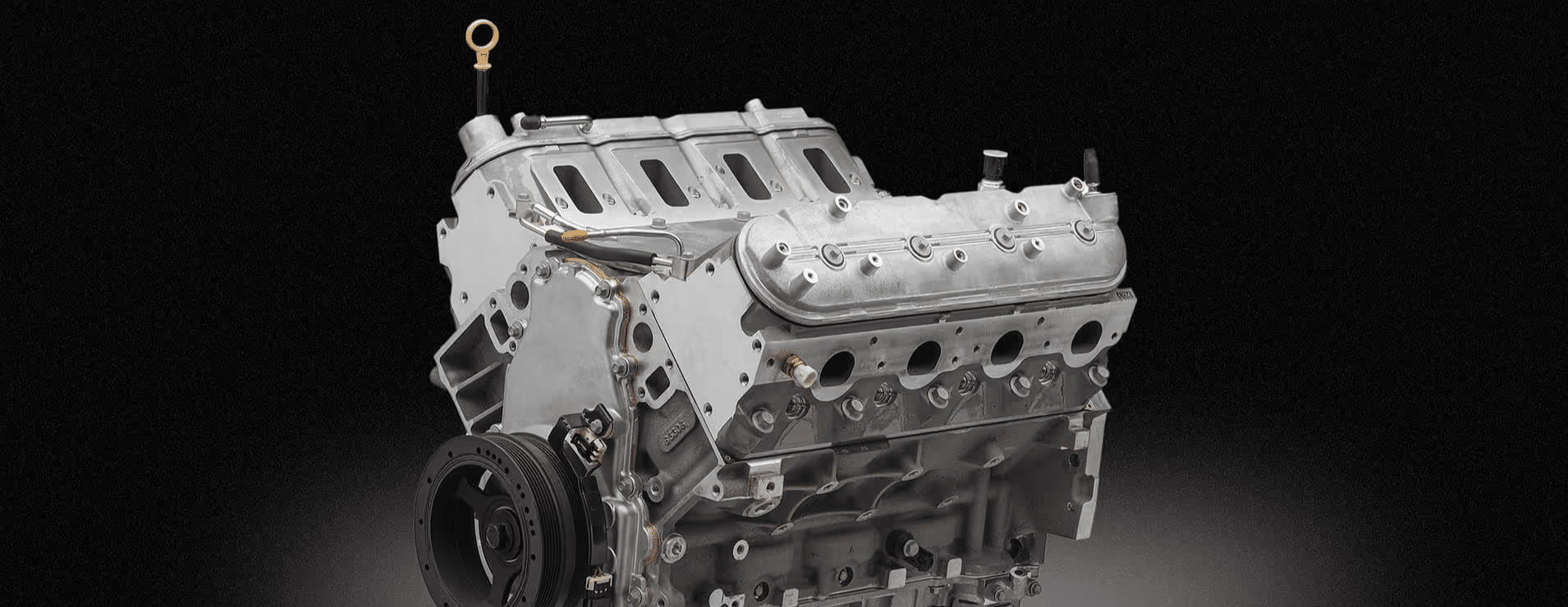 Close-up view of a high-performance engine with a supercharger, showcasing intricate details like the air intake system and engine components, highlighting automotive engineering and performance tuning.