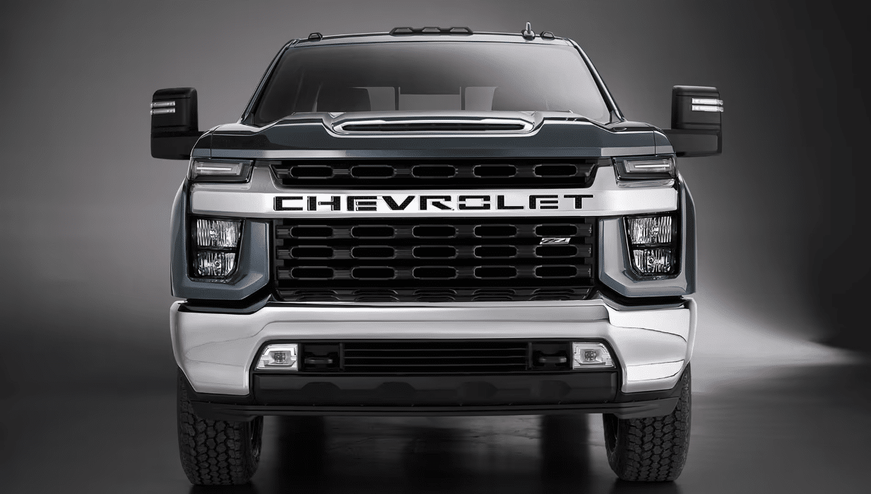Front view of a Chevrolet heavy-duty truck, showcasing its bold grille, headlights, and chrome accents, designed for durability and performance.