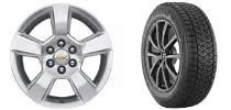 Black steel wheel and modern alloy wheel with premium tire, showcasing different types of automotive wheels for various vehicle needs.