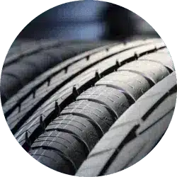 Close-up view of multiple car tires showcasing tread patterns, emphasizing durability and performance for automotive applications.