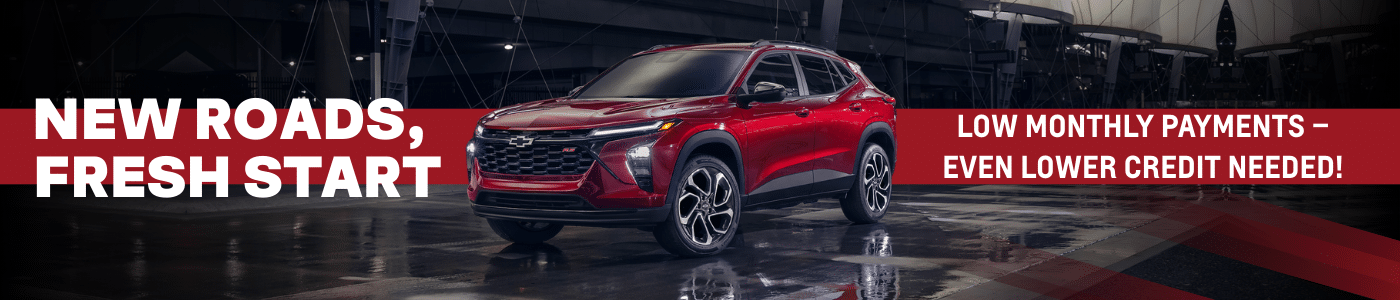 Sleek red crossover SUV showcased in a well-lit indoor setting, promoting low monthly payments and flexible financing options for customers with diverse credit backgrounds.