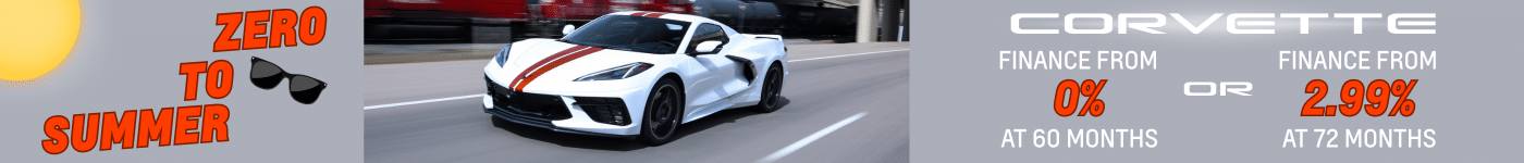 White Corvette with red stripes on a road, promoting financing options from 0% at 60 months or 2.99% at 72 months.